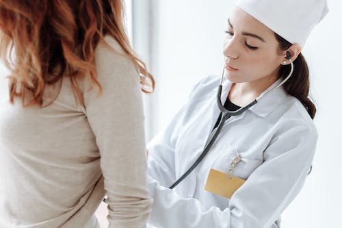 Free Photo Of Doctor Checking On Her Patient Stock Photo